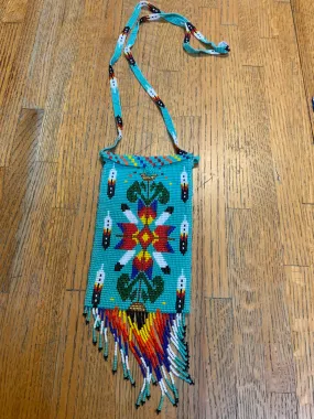 Handcrafted glass seed bead crossbody bag.  10” x 4” including fringe. BZ501